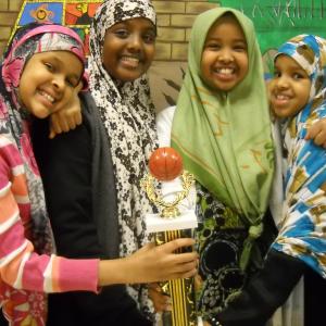 Somali girls winning basketball trophy