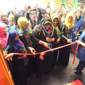 Sisterhood boutique interns cutting the ribbon at their new store.